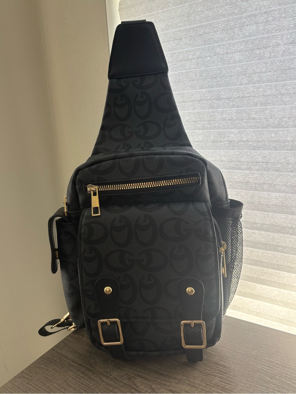 Black Sling Backpack with Signature Pattern